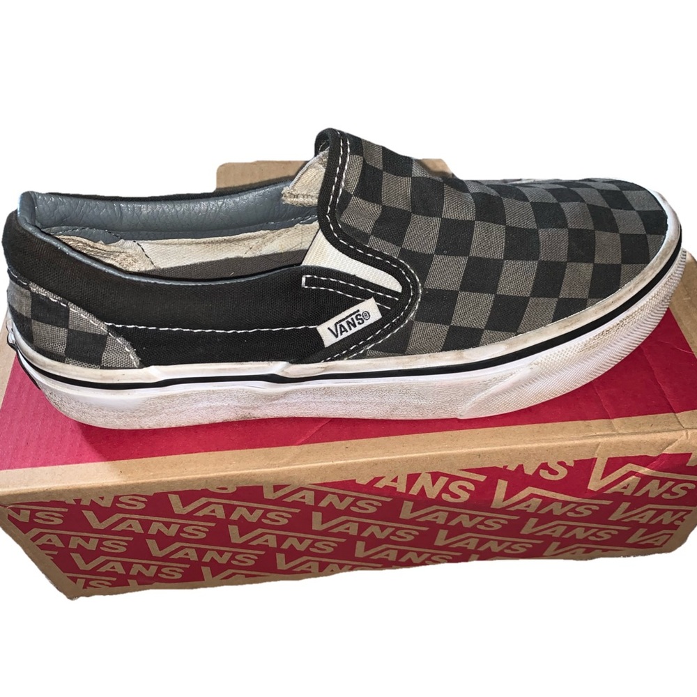 Black and grey slip on checkered vans